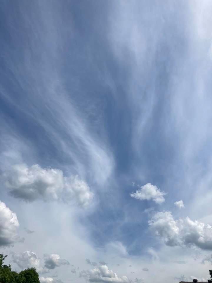 Floating clouds mixed with whispy clouds