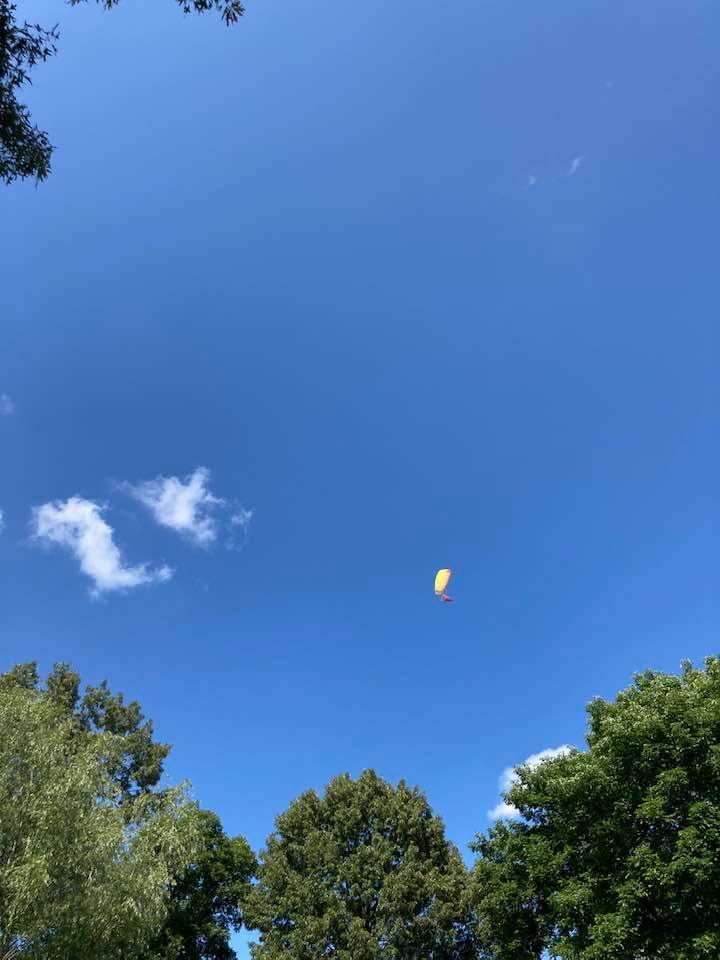 a parachutist floating through the sky