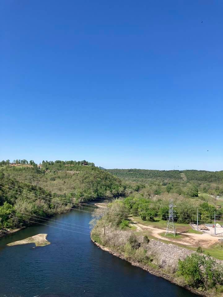 an aerial view of the river and some power lines