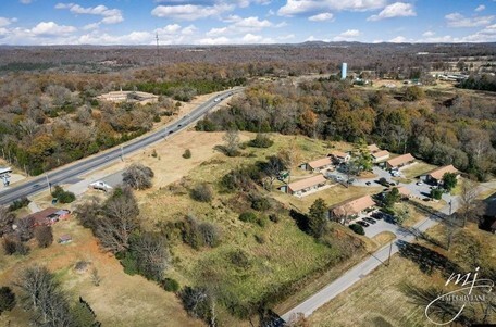 An aerial view of land with highway 62 on the left.